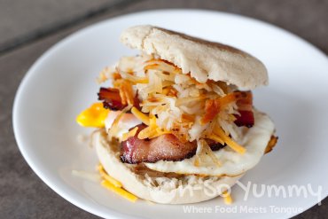 Super Bacon, Fried Egg, Cheddar Cheese, Hash, and English Muffin Sandwich